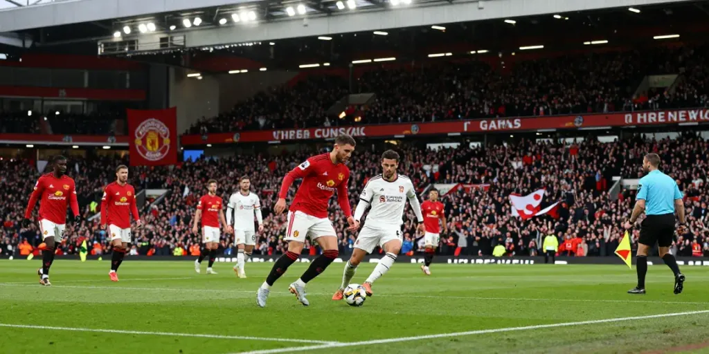 Manchester United and Liverpool players competing fiercely in a thrilling match atmosphere.